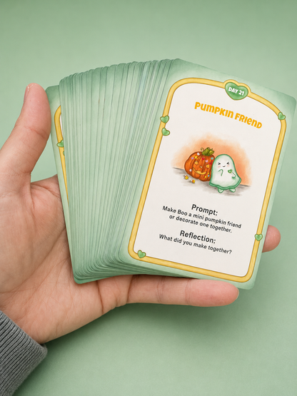 A hand holds a fanned deck of mint green cards against a solid light green background. The top card is titled 'Pumpkin Friend' and features a cute illustration of a small green ghost and a pumpkin.