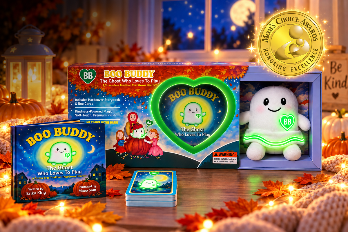 Boo Buddy The Ghost Who Loves To Play board game set displayed with its box, game board, cards, and plush ghost toy on a decorated autumn table with warm lights and pumpkins. A Mom's Choice Awards 2024 Reading Excellence seal is shown in the upper right.